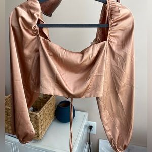 Silky brown long sleeve top with lace up back.